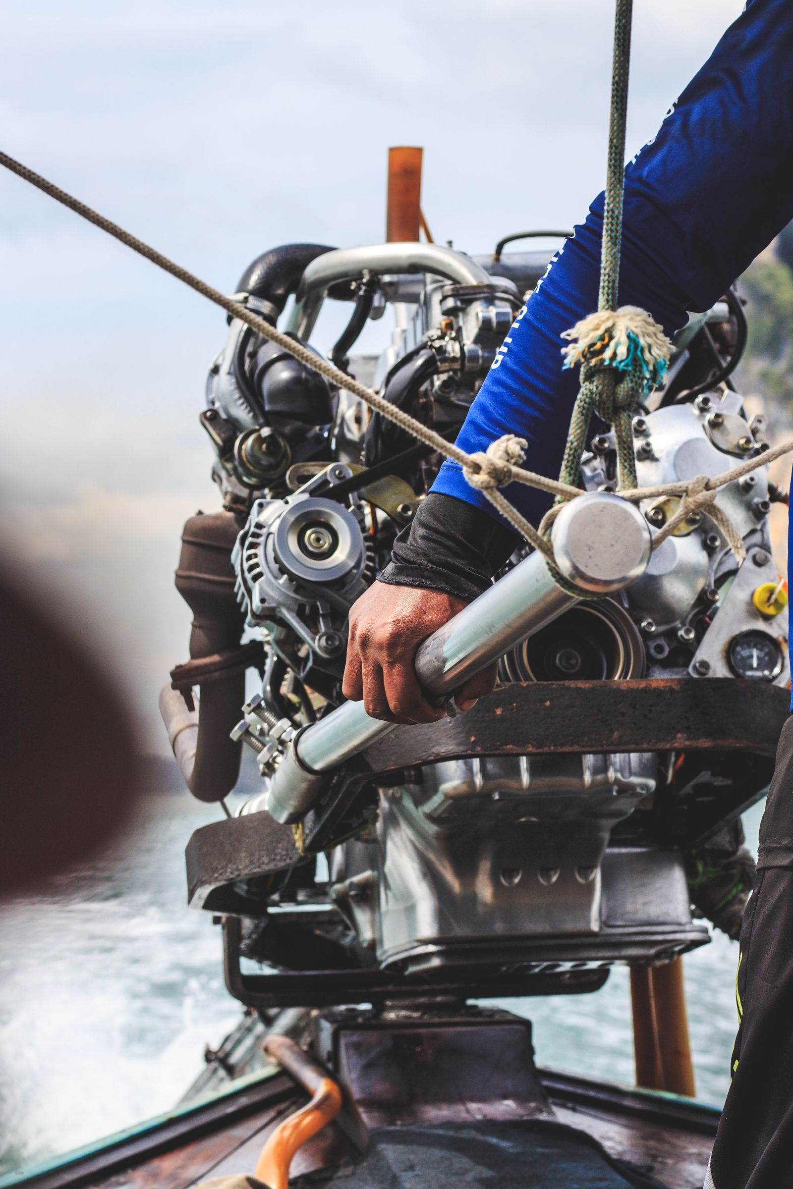 Technician handling a marine engine
